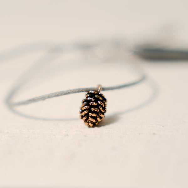 Grey Cord Bracelet with Rose Gold Pine Cone metal charm
