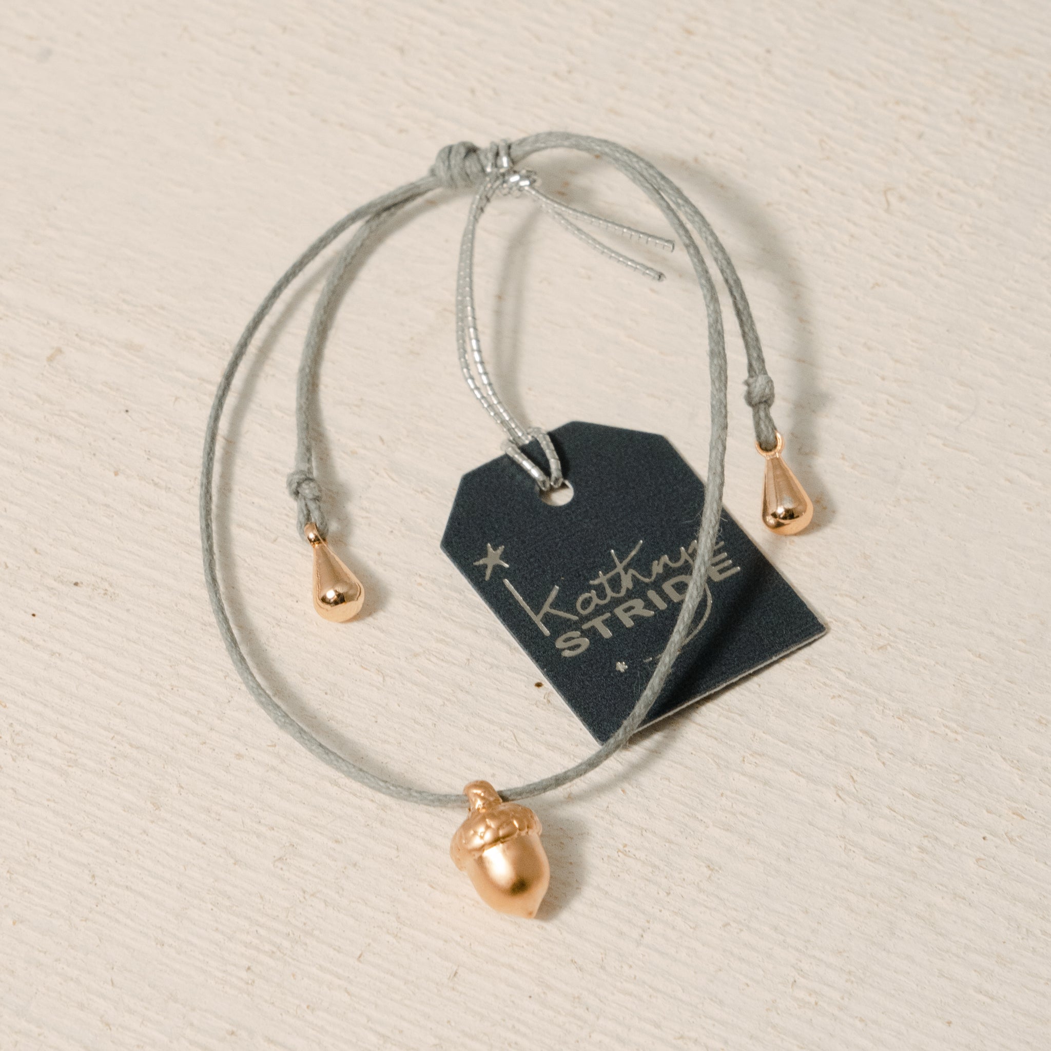 Grey cord Bracelet with Rose Gold Acorn metal charm
