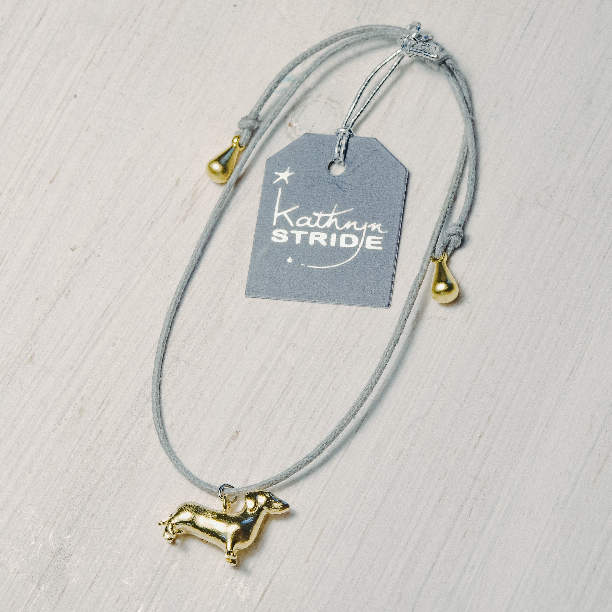 Grey cord Bracelet with tiny Dachshund charm